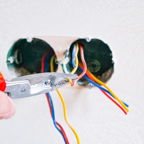 Licensed electrician performing electrical work in a San Francisco home