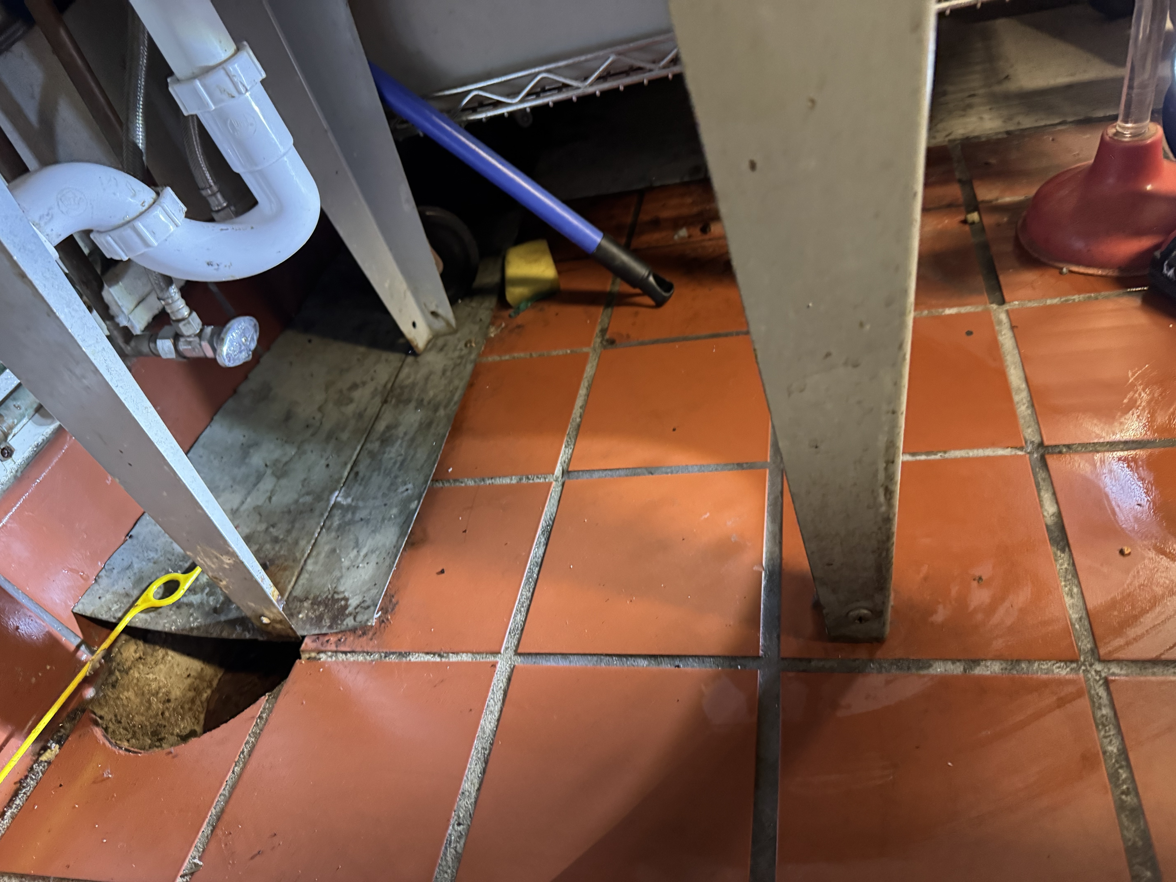 Diagnostic view of under-sink plumbing pipes and leak inspection in Sunset District